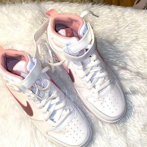 Pink and white high top Nikes